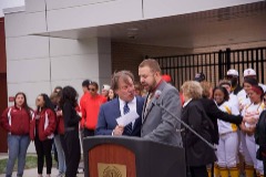 McKinney pictured with Triton College Board of Trustees Chairman Mark Stephens doing some final preparations of the ceremony he was MC at for the unveiling of the renovated outdoor fields and athletic complex in 2016.